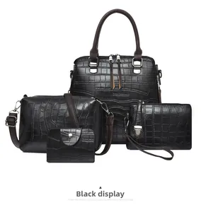Vue détaillée du lot de 4 sacs à main noirs avec motif crocodile et boucles argentées