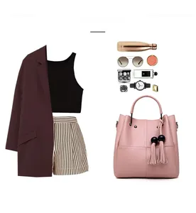Pink PU leather handbag detail with tassel charm and trendy fashion outfit coordination