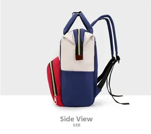 Side view of multi-color diaper backpack featuring red, white, and blue patchwork details