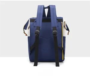 Detail of the navy blue canvas backpack back view with wide adjustable shoulder straps