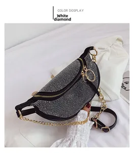 Detail of crescent rhinestone crossbody bag with silver crystals and gold chain strap