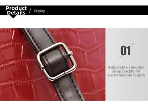 Détail du sac rouge croco avec bandoulière marron réglable et boucle en argent