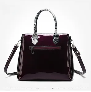 Glossy burgundy crocodile pattern tote with snakeskin handle and rear zipper pocket