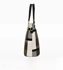 Side view of large patchwork tote bag featuring grey white and brown faux leather detail