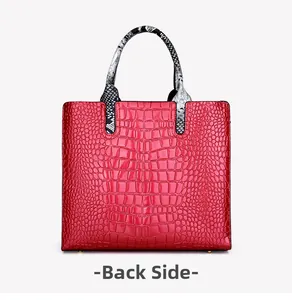 Detailed back view of a red crocodile embossed tote bag with snakeskin pattern handles
