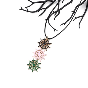 Minimalist Halloween spider web necklace set with black pink and green web pendants