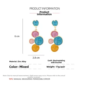 Detail view of colorful enamel geometric drop earrings showing 6cm height and 2.8cm width
