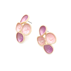 Detail of pink and purple enamel petal earrings with gold metal edges and pearls