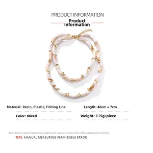 Detail of layered resin bead necklace with marble texture and gold adjustable lobster clasp