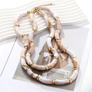 Layered chunky resin necklace with marble textures and gold metal accents for women
