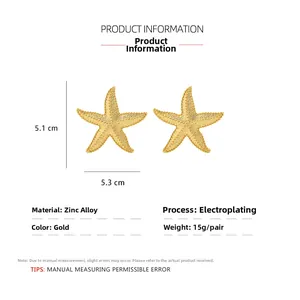 Detail showing dimensions of golden starfish earrings with 5.1cm x 5.3cm measurements