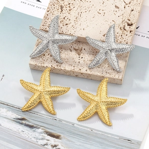 Vintage French alloy starfish earrings in textured gold and silver metal finishes