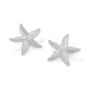 Close-up of silver starfish earrings featuring detailed grainy texture and five-point design