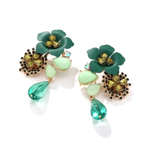 Detail view of Bohemian multi-layer green flower earrings with crystal embellishments