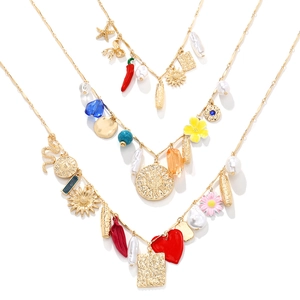 Collana multistrato oro boho con ciondoli a girasole cuore e perle finte