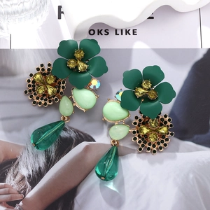 Detail view of Bohemian floral earrings with green petals, rhinestones and waterdrop beads