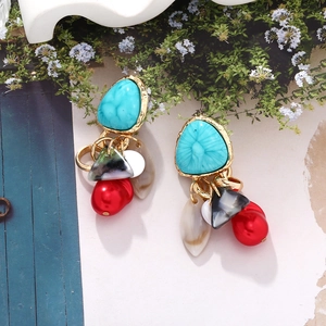 Bohemian drop earrings featuring turquoise stones, red pearls and marble pendants