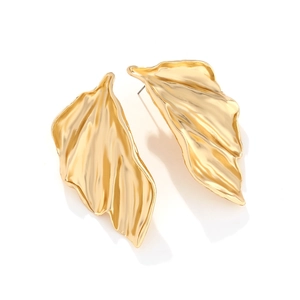 Detail shot of golden textured leaf earrings with modern artistic crinkled metal surface