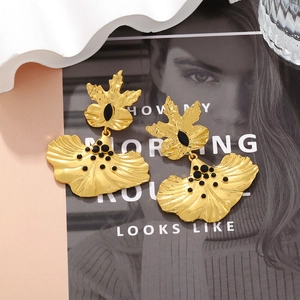 Vintage gold layered flower earrings with leaf texture and black resin bead details