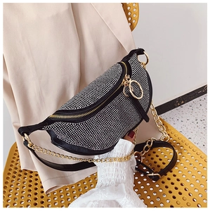 Detailed view of black rhinestone saddle bag featuring gold chain and sparkling crystal finish