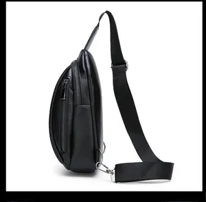 Side view of men's black crocodile pattern chest bag with zipper and metallic buckle