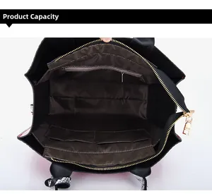 Top view of spacious handbag interior with a zipper pocket and two open side compartments