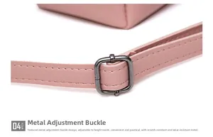 Detail of pink leather shoulder strap with a durable grey metal adjustable buckle