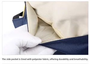 Detail view of the deep blue backpack's durable side pocket with yellow zipper and lining