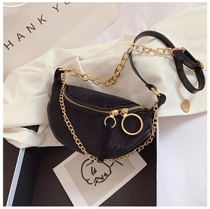 Close-up of black crescent rhinestone bag with gold chain strap and ring zipper