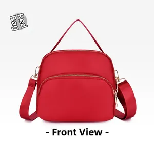 Front view of red waterproof oxford fabric shoulder bag with double zipper pockets