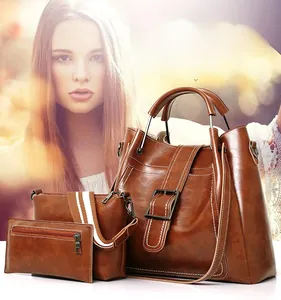 Detailed set of brown PU tote bag, crossbody bag with striped strap and small pouch