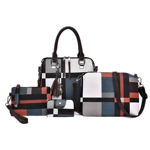 Fashionable four-piece patchwork handbag set with geometric color blocks and tassels
