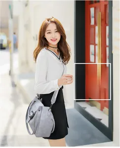 Close-up of stylish light blue-grey 3-piece bag set with elegant belt buckle decor