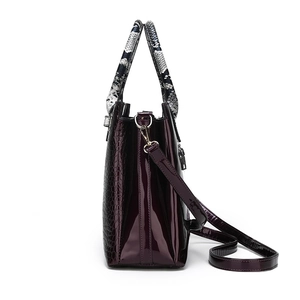 Stylish purple crocodile-embossed faux leather tote bag with snakeskin handles