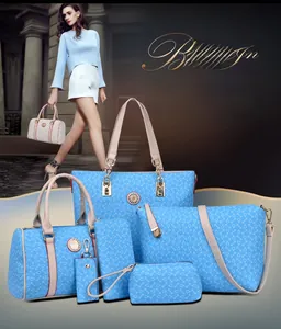 Detail of 6-piece blue nautical handbag set with anchor print and tan leather handles