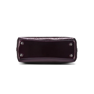 Bottom view of purple crocodile embossed tote bag with silver protective metal studs
