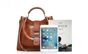 Brown tote bag size comparison featuring an iPad and a magazine on white background