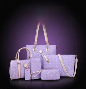 Purple six-piece bag set with geometric patterns and golden hardware on gradient background