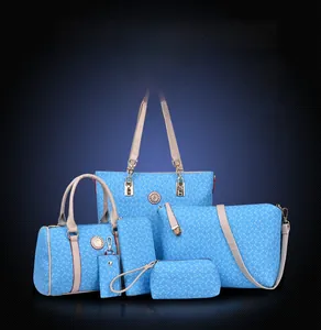 Macro detail of sky blue 6-piece handbag set with white bone pattern and gold hardware