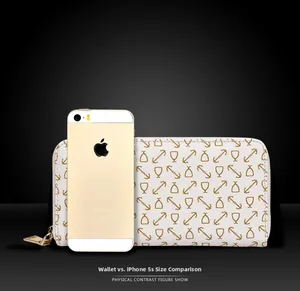 Size comparison of a nautical print wallet next to a mobile phone for scale