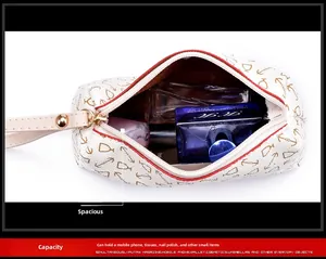 Detail view of a white PU leather cosmetic pouch with gold anchor print and large capacity