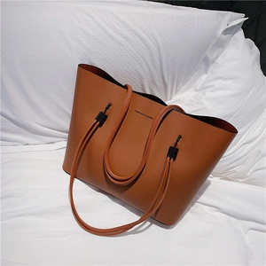 Brown PU leather tote bag with Forever Young print and black hardware for daily use