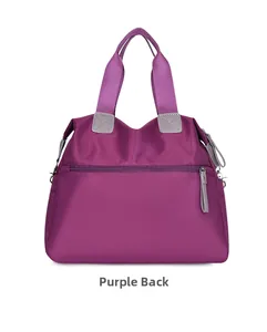 Purple oxford cloth crossbody bag back view with zippered pocket and durable handles