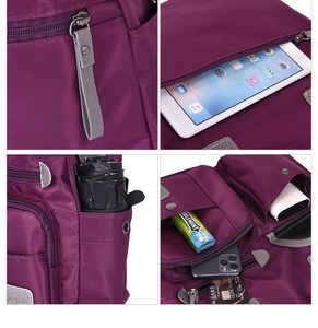 Detail view of multi-compartment purple nylon backpack with waterproof fabric