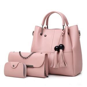 Three-piece pink faux leather handbag set with tote, chain bag, and fringe tassel charm