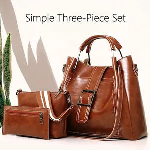 Three-piece brown PU leather handbag set with contrast stitching and metal buckle detail
