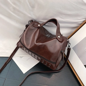 Deep brown Boston shoulder bag with polished faux leather and silver bottom studs