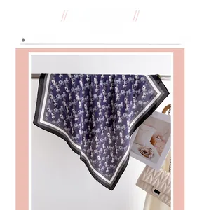 Detail of luxury silk scarf with vintage carriage print and geometric striped borders
