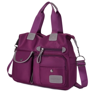 Waterproof purple nylon shoulder bag with multiple pockets and adjustable strap