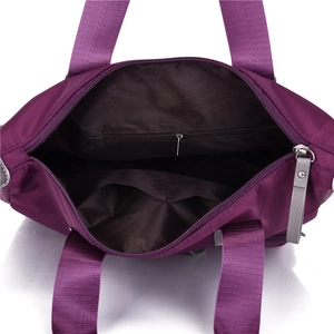 Waterproof purple oxford crossbody bag with spacious interior pockets and floral lining